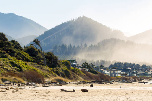Oceanfront vacation homes along Cannon Beach Oregon Coast by Pacific Ocean stock photo