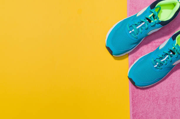 istock Fitness accessories on yellow background mock up, top view 910163516