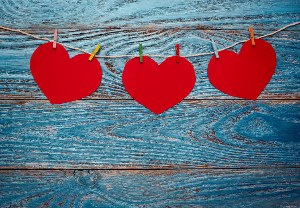 istock Valentines day background decorated with red hearts and postcard/copy space 910166010