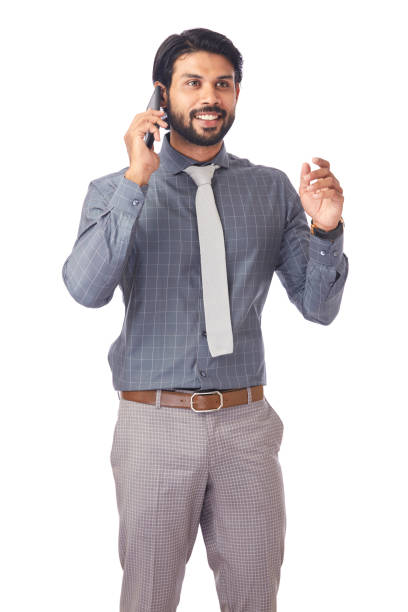 Handsome young businessman Talking On Cell Phone over white background.