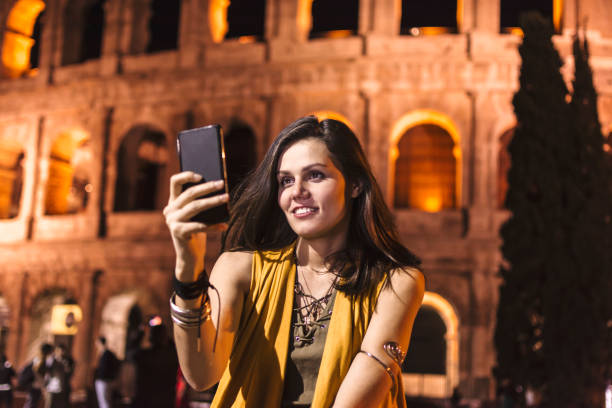 istock Smiling girl with phone 910189036