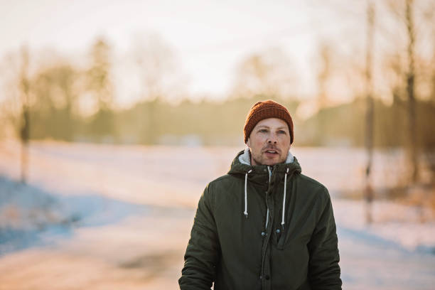 istock Man outdoors on cold frosty winters day 910189470