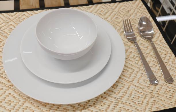 istock Set of Porcelain Plates, Bowls and Silverware 910189472
