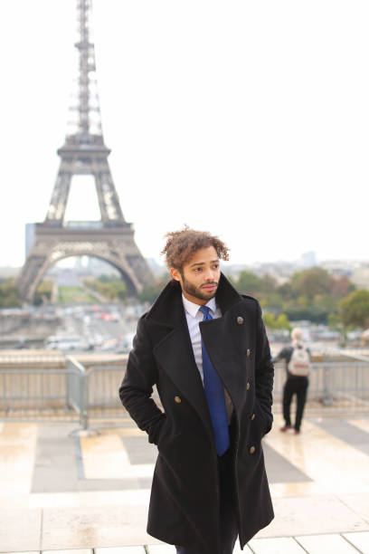 male model smiling near Eiffel Tower