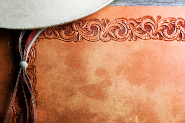 istock Stampede String Of Cowboy Hat On A Tooled Leather Surface 910195230
