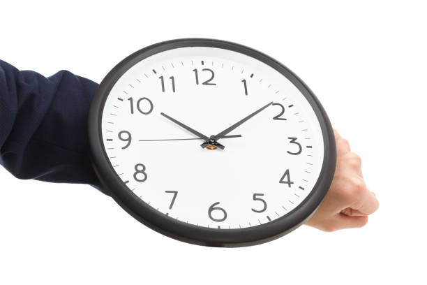 istock Businessman hand holding wall clock, time management 910201090