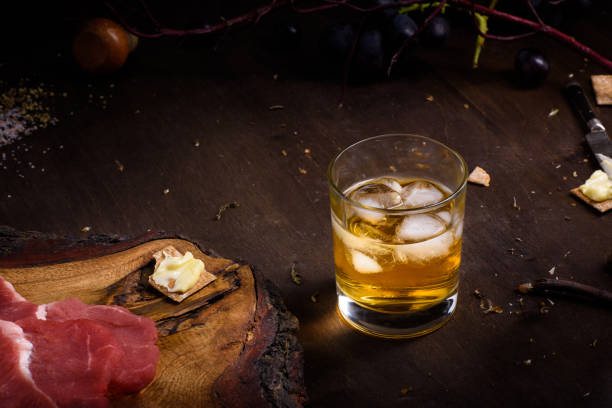 raw meat, beef steak on wooden table, a glass of whiskey. - scotch steak imagens e fotografias de stock