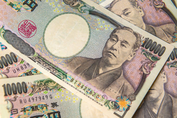 japanese yen bank note - moeda japonesa imagens e fotografias de stock