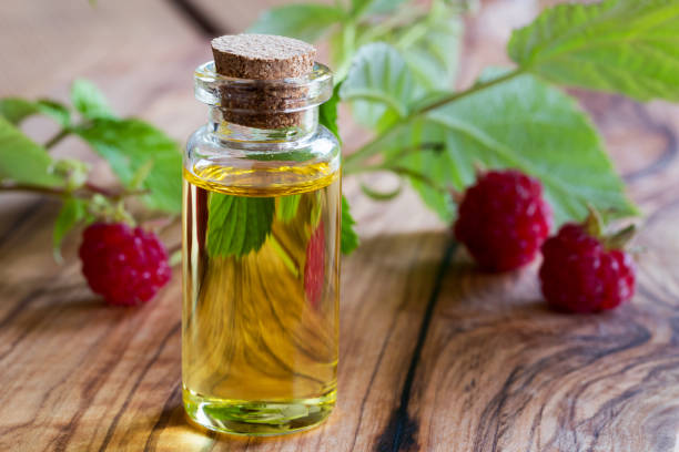 istock A bottle of raspberry seed oil with fresh raspberries 910214014