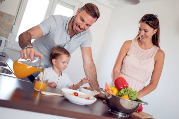istock Happy young family having fun at home 910214742