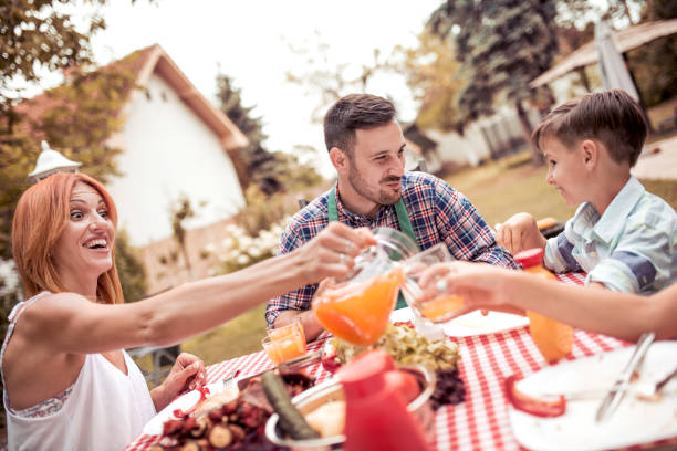 istock Young family having barbecue party 910218080