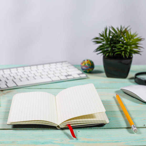istock Office desk table with computer, supplies, flower and coffee cup. 910219470
