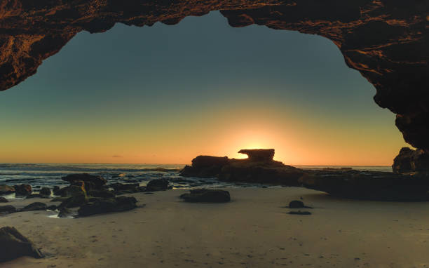 istock Sunrise Seascape from Cave 910225450