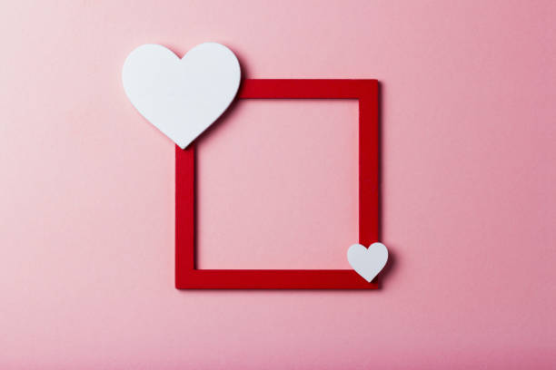 istock Frame with a heart on a pink isolated background 910225510