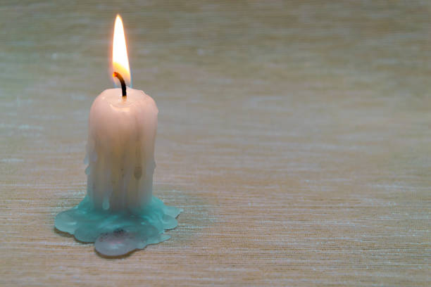 Candle burn and warm light on the wall background.