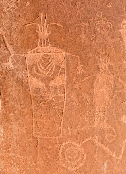 Pre-Columbian Anthropomorphic petrogyphs on the cliffs on the Escalante River Canyon in Grand Staircase Escalante National Monument, Utah.
