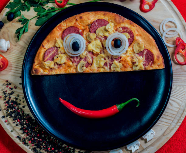 istock Large hot pizza on the black plate. 910226664