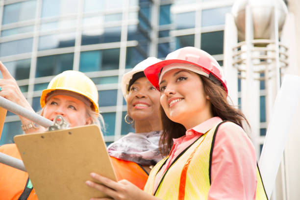 istock STEM Female engineer or architect team working on a construction project in city. 910235086