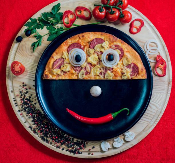 istock Large hot pizza on the black plate. 910235212