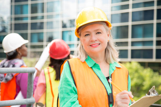 istock STEM Female engineer or architect team working on a construction project in city. 910235438