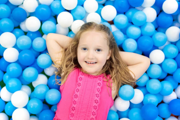 istock Kids play in ball pit. Child playing in balls pool 910246912