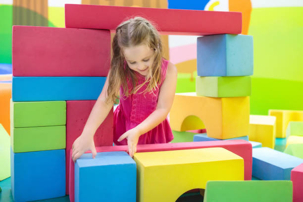 istock Kids play. Construction toy blocks. Child toys 910251928