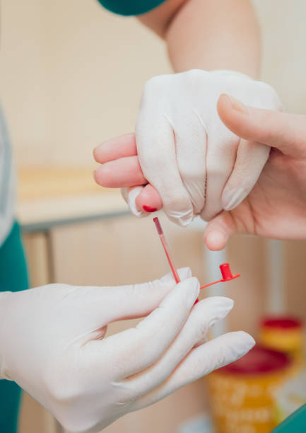 istock Nurse taking a blood sample. Medical equipment. 910252304