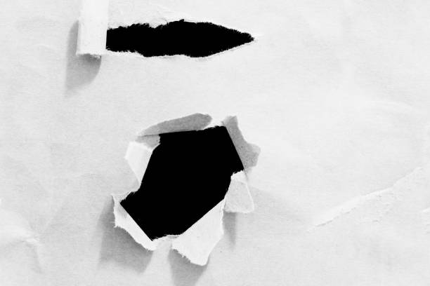 istock pieces of hole torn paper 910253016