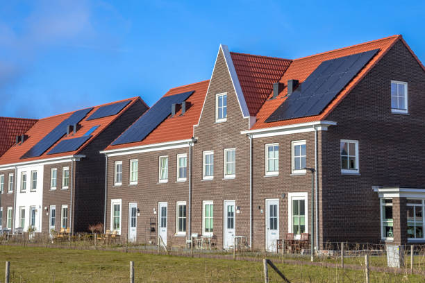 istock Modern row houses with  solar panels on sunny day 910255508
