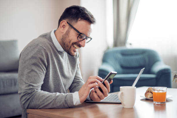 istock Man working on laptop at home 910259384