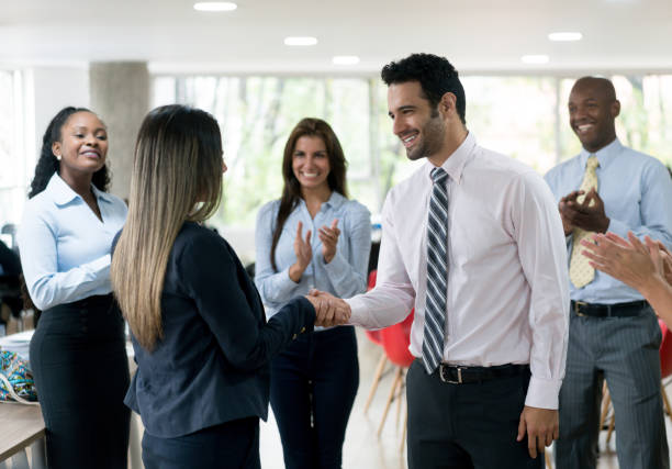 istock Business people at the office closing a deal with a handshake 910261908
