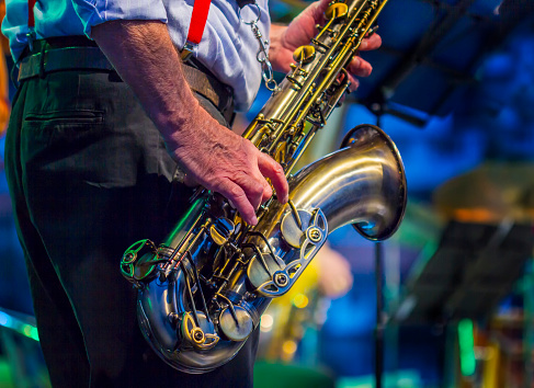 Saxophone player performing on stage