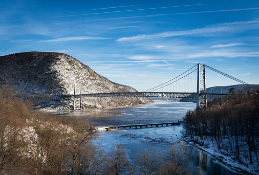 The long suspension bridge from Bear Mountain to Anthony`s Nose across the Hudson River in New York