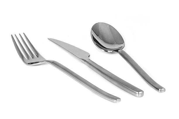 istock Trendy metal fork knife and spoon isolated on white 91028006