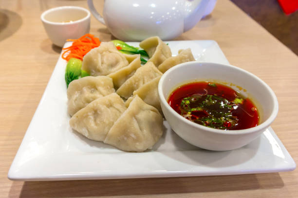 istock Traditional Chinese Boiled Dumpling With Hot Dipping Sauce 910286242