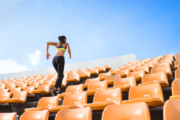 asian women run up the stairs. it is out of strength and cardio. - running athlete staircase teenager imagens e fotografias de stock