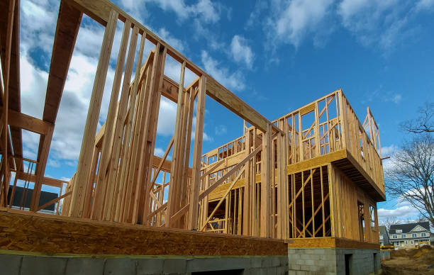 istock Wood Building frame at Multi-Family Housing Construction Site 910290280