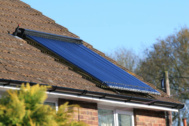istock Solar energy panel glass tube water array on house roof 91030249
