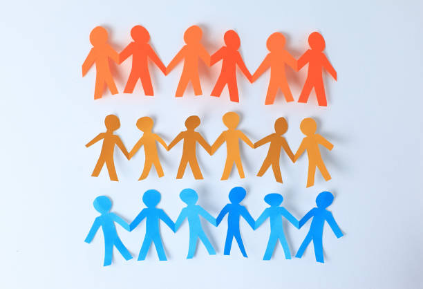 istock three teams paper men taking each other's hands 910306856
