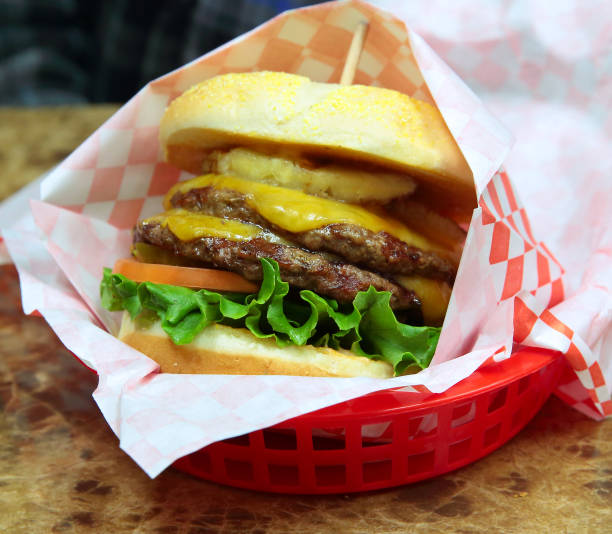 istock Double Hawaiian Cheeseburger on a Toasted Kaiser Roll with Pineapple 910311302