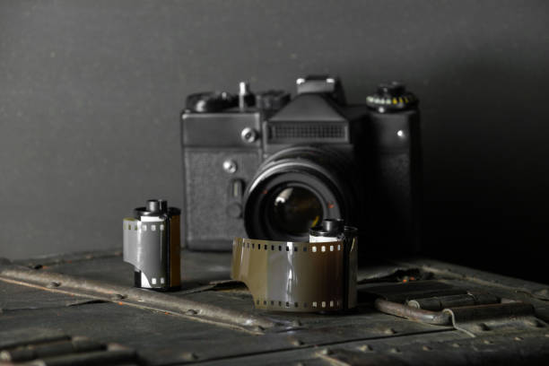 istock Old retro camera and 35 mm film 910314488