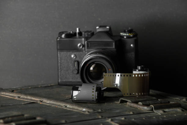 istock Old retro camera and 35 mm film 910314496