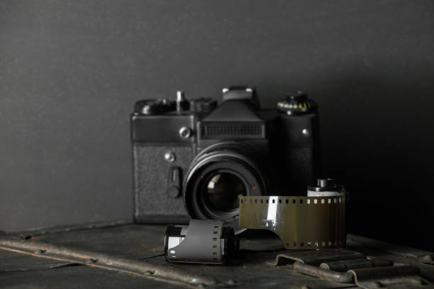 istock Old retro camera and 35 mm film 910314504