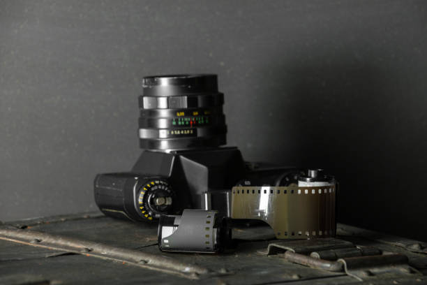 istock Old retro camera and 35 mm film 910314506