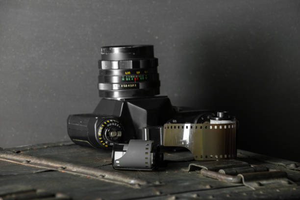 istock Old retro camera and 35 mm film 910314526