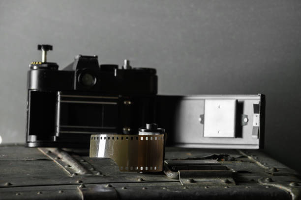 istock Old retro camera and 35 mm film 910314528