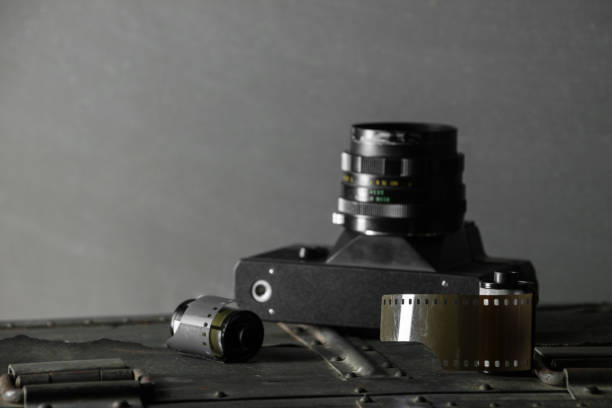istock Old retro camera and 35 mm film 910314580