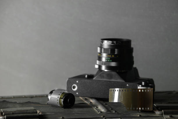 istock Old retro camera and 35 mm film 910314590