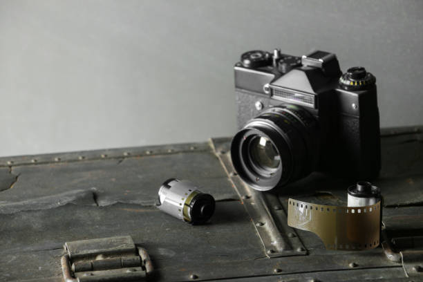 istock Old retro camera and 35 mm film 910314652