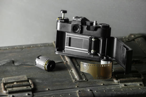 istock Old retro camera and 35 mm film 910314664